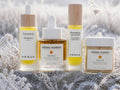 The Age-Defying Edit - four Nordic anti-aging skincare products on frozen meadow